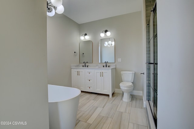 bathroom with vanity, toilet, and a shower with door