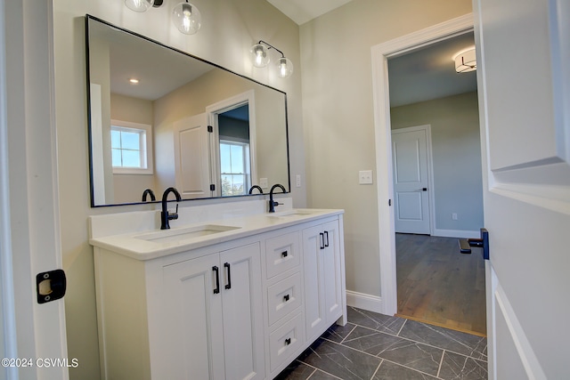 bathroom with vanity and hardwood / wood-style flooring