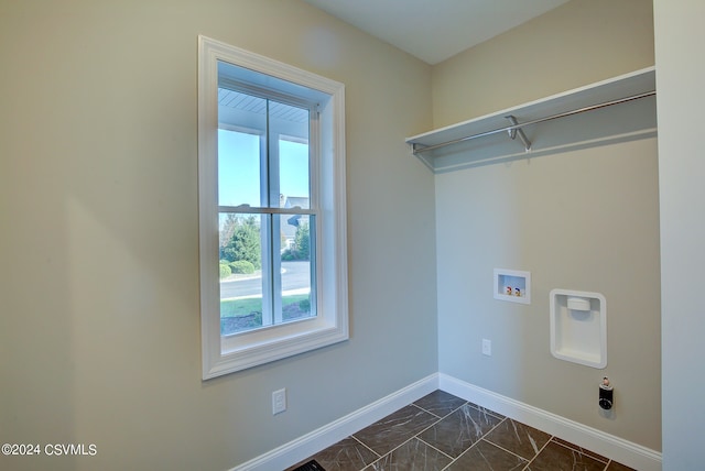 clothes washing area featuring washer hookup