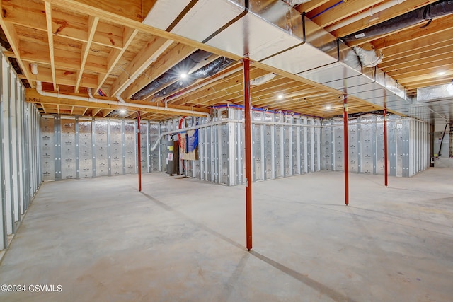 basement featuring electric water heater