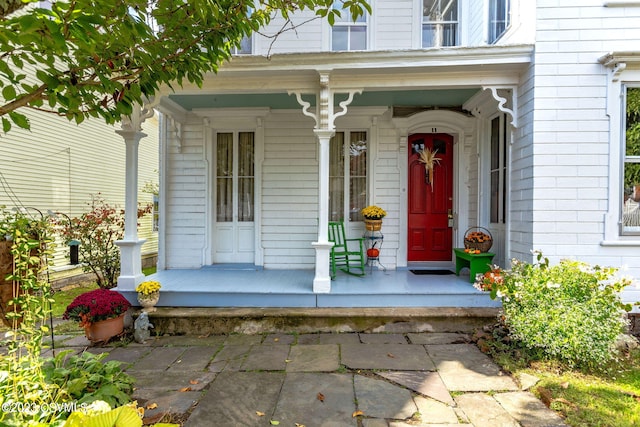 doorway to property with covered porch