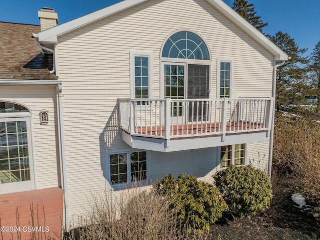 view of side of property featuring a balcony