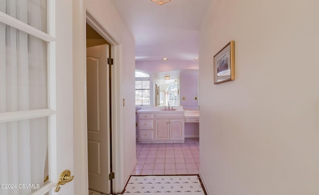 hallway with light tile patterned flooring