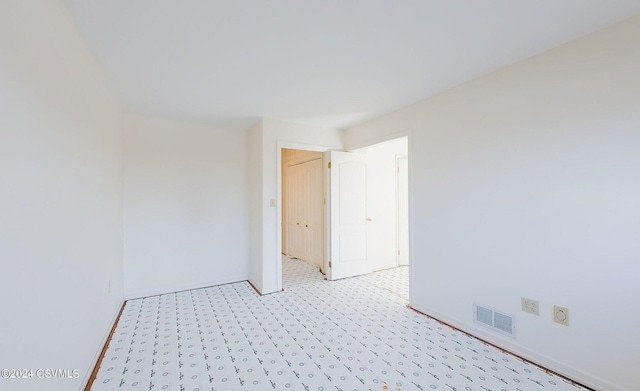 spare room with light colored carpet