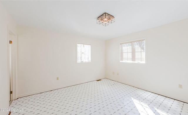 spare room with a wealth of natural light