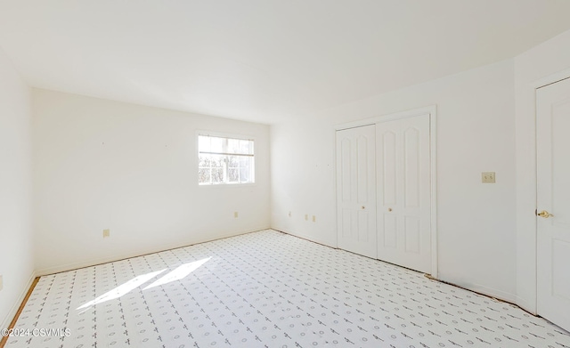 unfurnished bedroom with light carpet