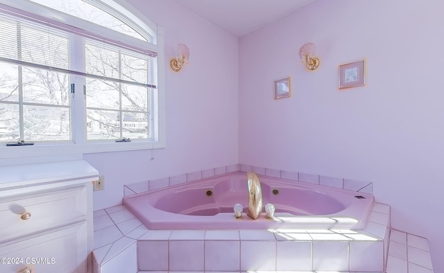 bathroom with tiled bath