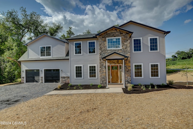 view of front facade with a garage and a front yard