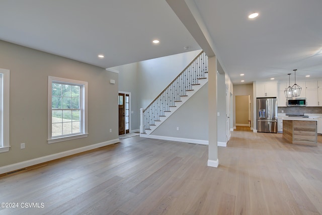 foyer entrance featuring light hardwood / wood-style flooring