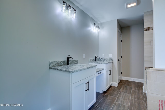 bathroom featuring tile patterned flooring and vanity