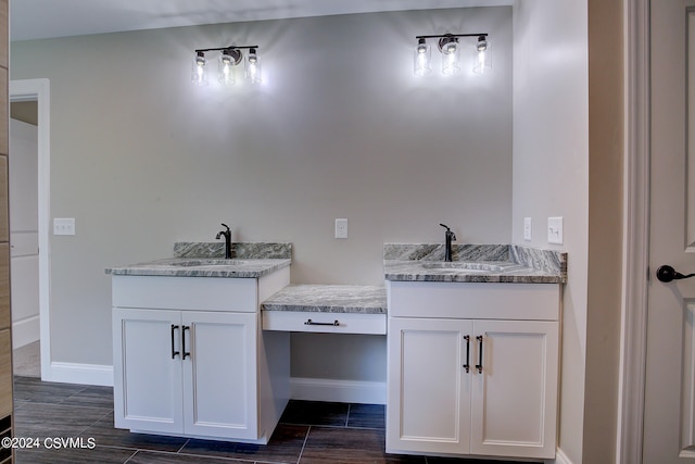 bathroom featuring tile patterned flooring and vanity