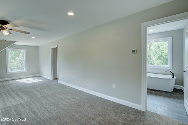 interior space featuring ceiling fan