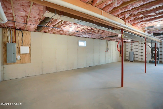 basement with electric panel and heating unit