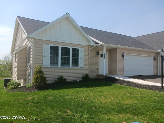 ranch-style house with a garage, central AC, a front yard, a shingled roof, and board and batten siding