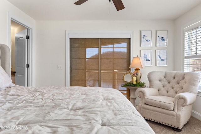 carpeted bedroom featuring ceiling fan and a closet