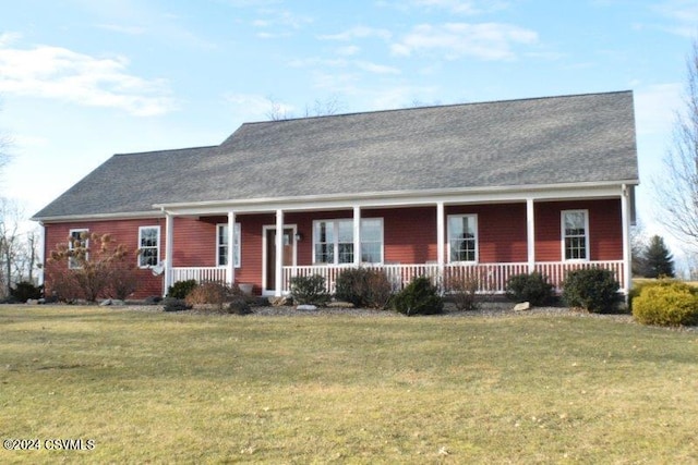 view of front of home with a porch and a front yard