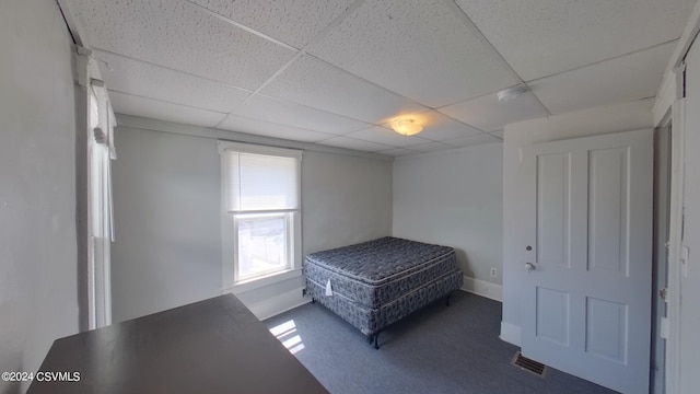 bedroom with a paneled ceiling