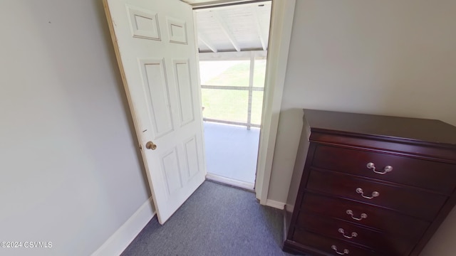 unfurnished bedroom featuring dark colored carpet