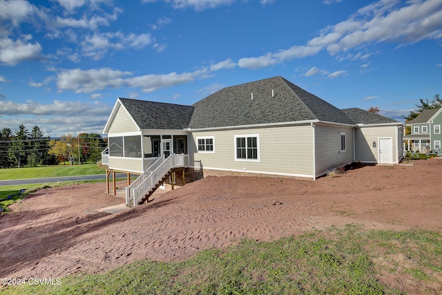 back of house with a sunroom