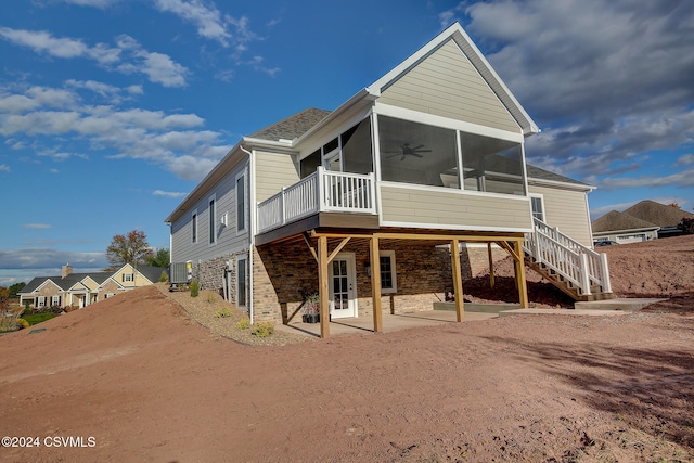 back of house featuring a patio, a sunroom, and ceiling fan