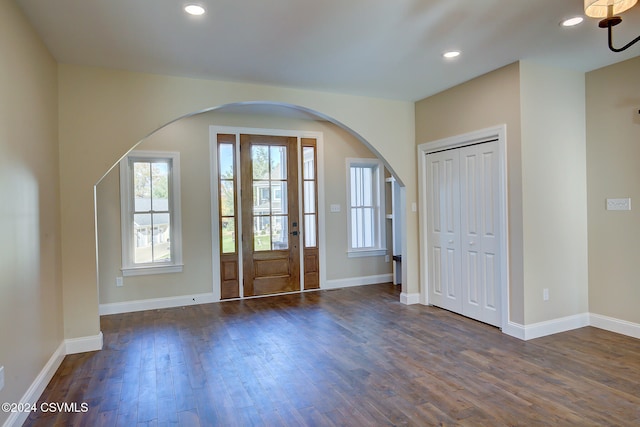 foyer entrance with dark hardwood / wood-style floors