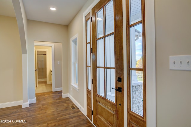 entryway with dark hardwood / wood-style floors