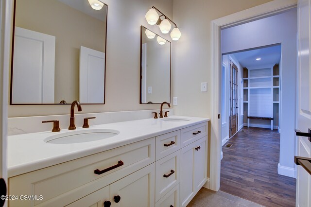 bathroom featuring vanity and hardwood / wood-style flooring