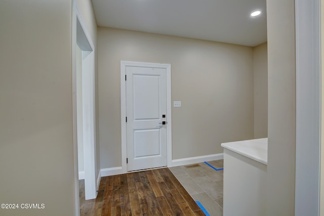 corridor with dark wood-type flooring