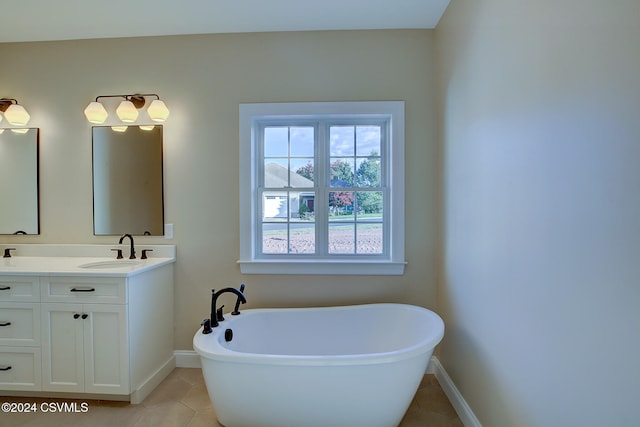 bathroom featuring vanity, a bathtub, and tile patterned flooring