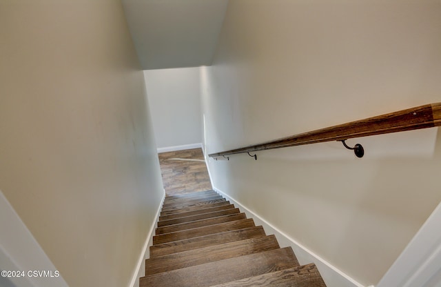 stairs with wood-type flooring