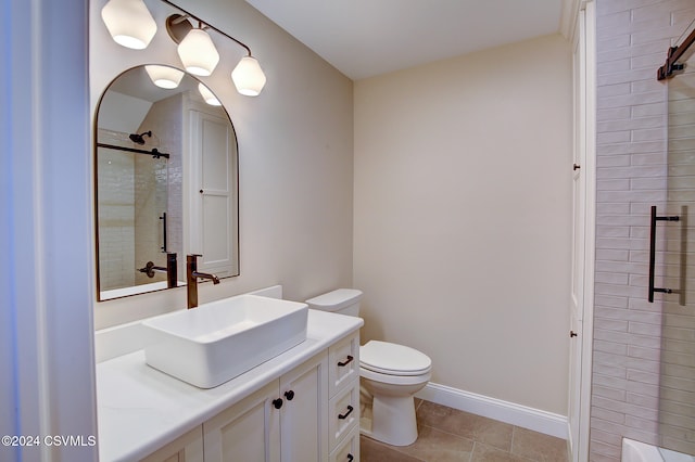 bathroom featuring vanity, toilet, a shower with shower door, and tile patterned flooring