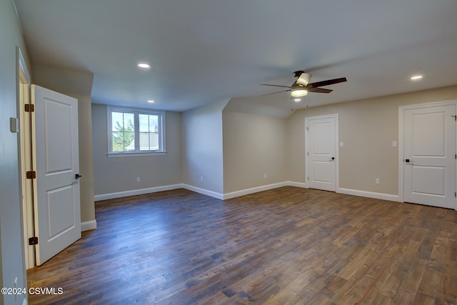 unfurnished room featuring dark wood-type flooring and ceiling fan