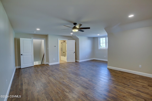 spare room with dark wood-type flooring and ceiling fan