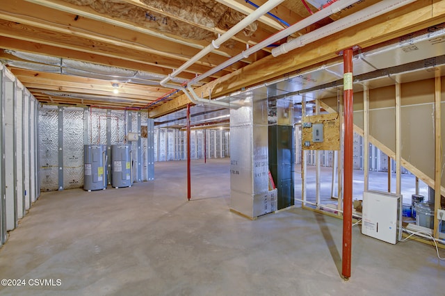 basement with electric water heater and heating unit