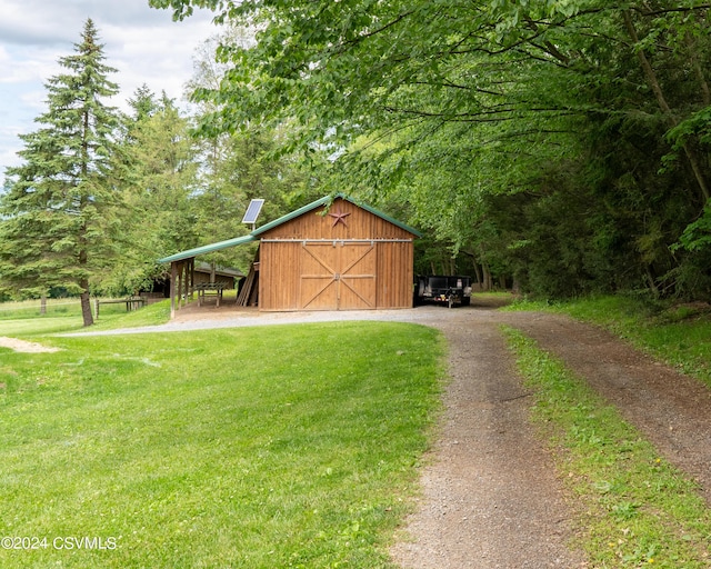 exterior space with a yard and an outdoor structure