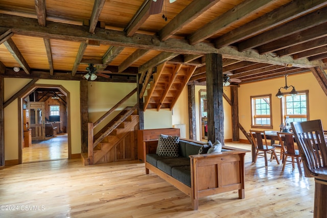 interior space with beamed ceiling, light hardwood / wood-style floors, and wooden ceiling