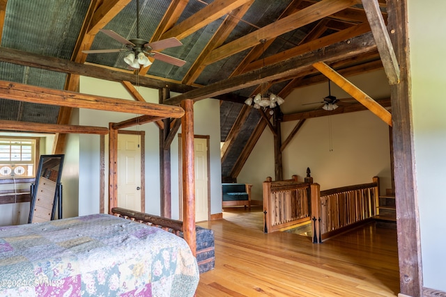 bedroom featuring ceiling fan, lofted ceiling, and light wood-type flooring