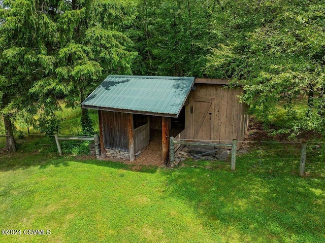 view of outdoor structure with a lawn