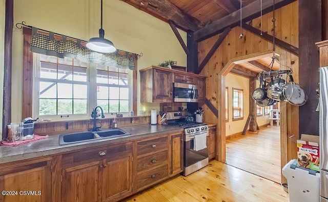 kitchen with wooden ceiling, sink, hanging light fixtures, light wood-type flooring, and stainless steel appliances