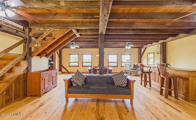 interior space featuring beamed ceiling, light hardwood / wood-style floors, and wood ceiling