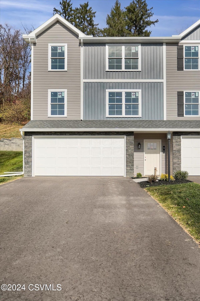 90 Limerick Ln, Selinsgrove, PA 17870 - view of property featuring an attached garage, asphalt driveway, and stone siding