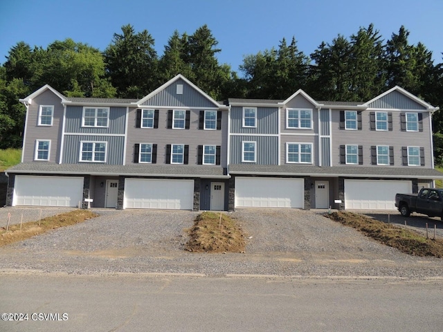90 Limerick Ln, Selinsgrove, PA 17870 - view of property featuring gravel driveway, a garage, and stone siding