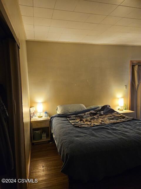 bedroom featuring wood finished floors