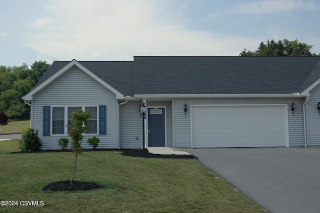 ranch-style home with a garage and a front yard