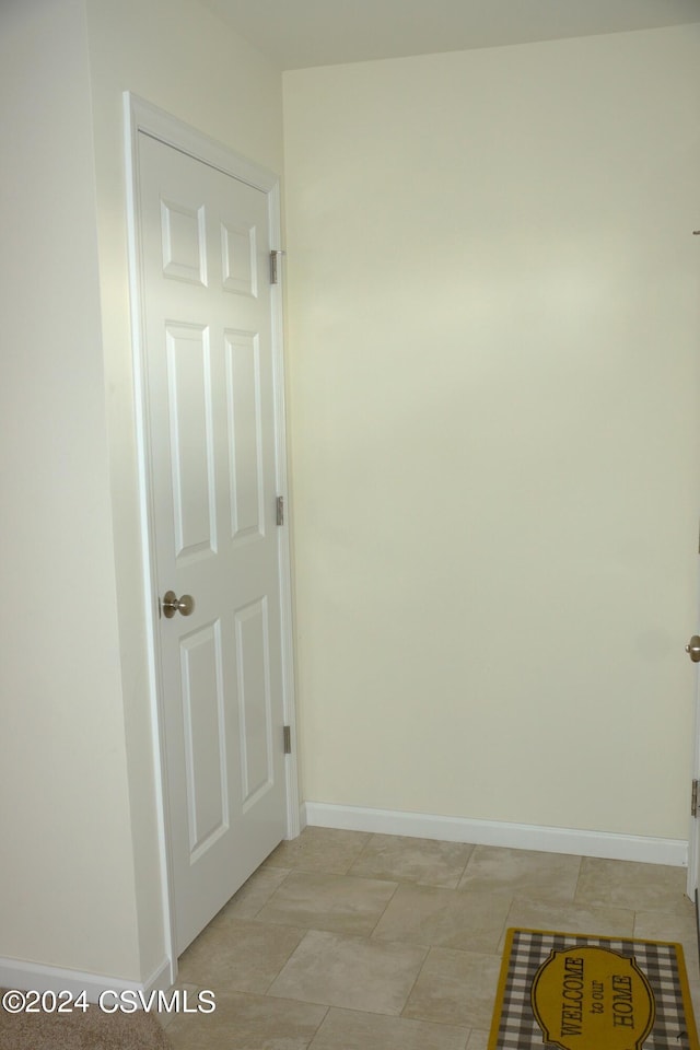 spare room with baseboards