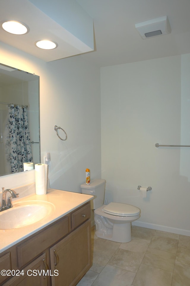 bathroom featuring baseboards, toilet, tile patterned floors, curtained shower, and vanity