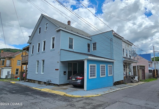 view of front of home with a balcony