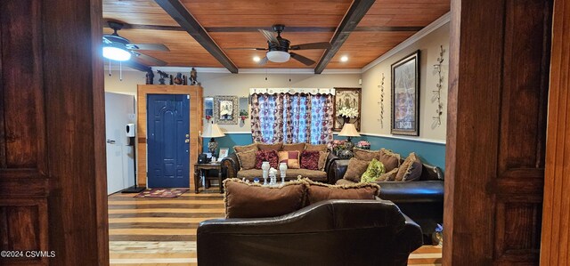 living room with ceiling fan, crown molding, wood ceiling, wood-type flooring, and beamed ceiling