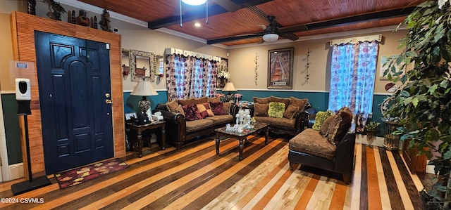 living room with ceiling fan, crown molding, beam ceiling, wood ceiling, and wood-type flooring