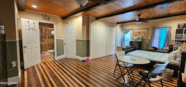 interior space with beamed ceiling, hardwood / wood-style flooring, wood ceiling, and ceiling fan